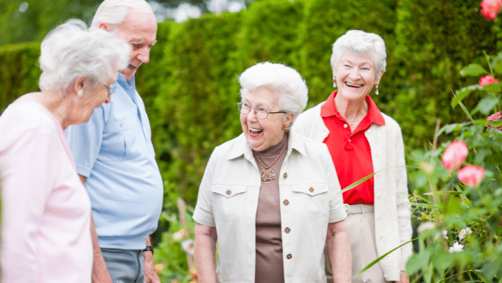 a group of seniors having a conversation while their walking