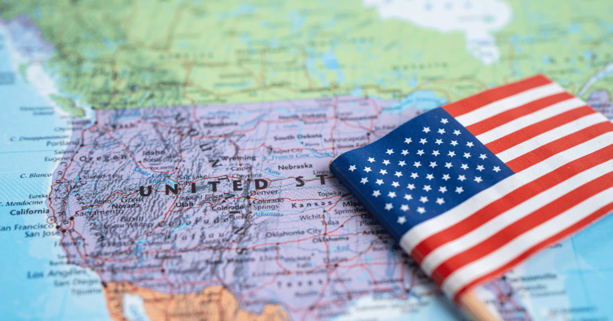 A map of the US with the flag