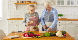 a senior couple cooking