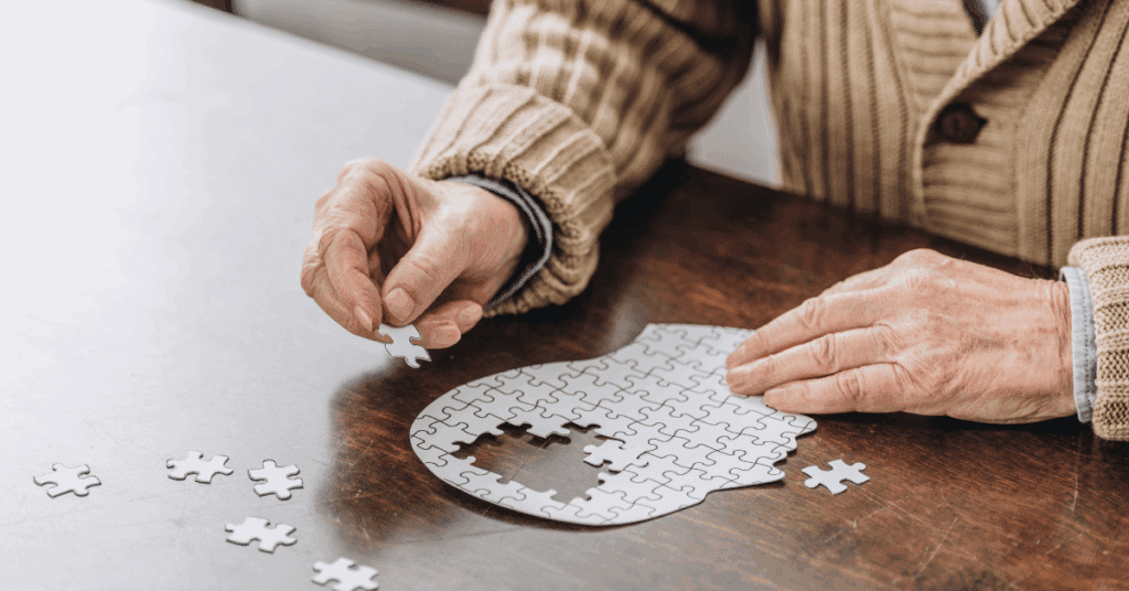 a senior man making a puzzle